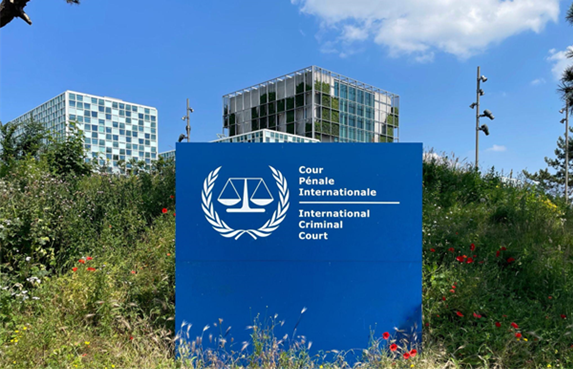 A blue sign at the entrance to the ICC building what future for international justice if major powers continue to sanction courts like the ICC?