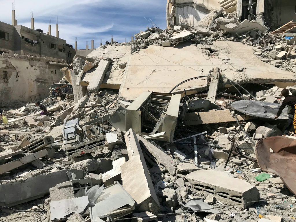 a pile of rubble next to a building