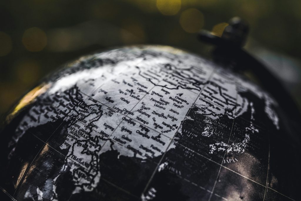 Map of Myanmar on a globe in black and white Myanmar's ongoing crisis